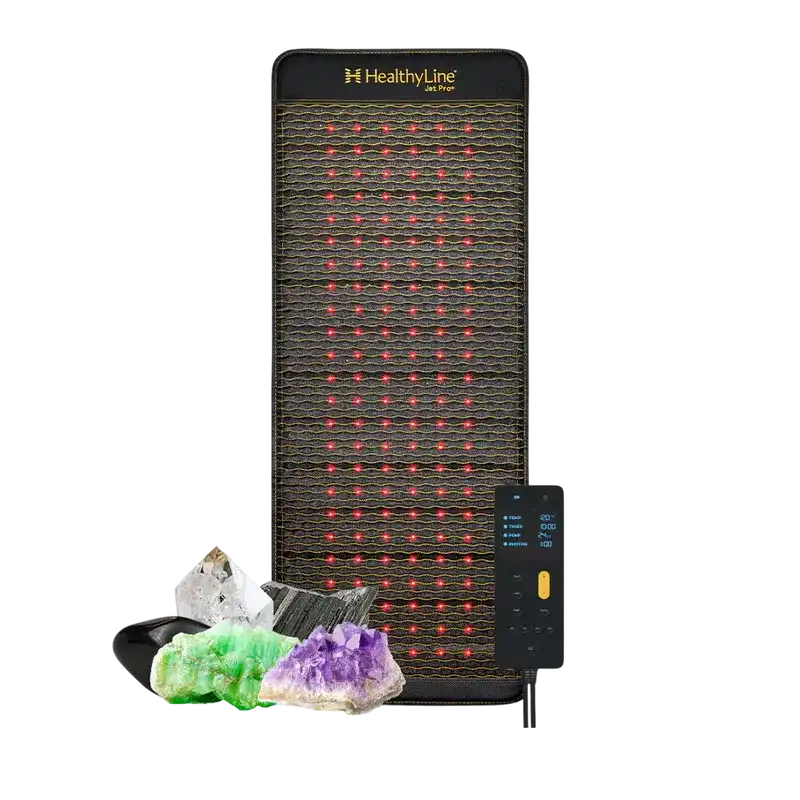 Therapy mat with gemstones and remote control for wellness and relaxation.